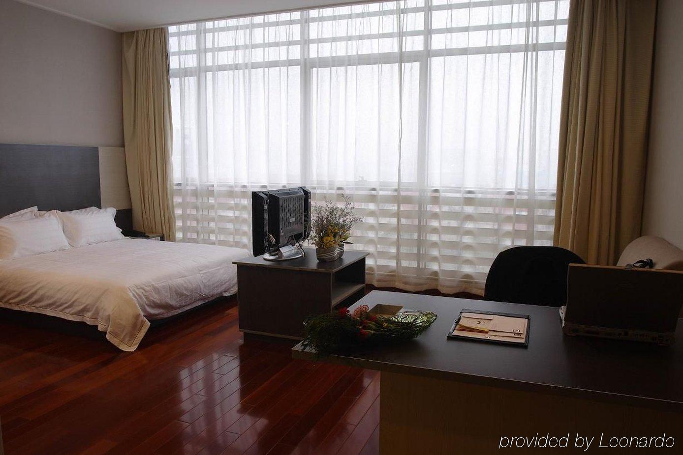 The Land Hotel Xangai Quarto foto
